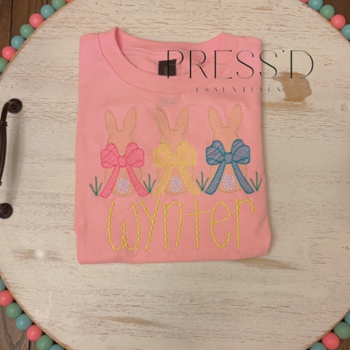 Toddler Easter bunnies with bow in grass sketch